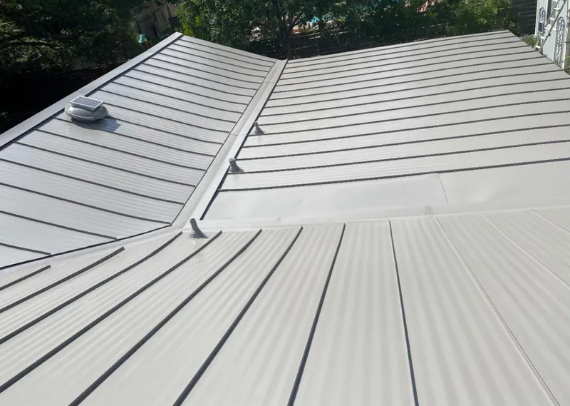 Solar attic fan installed on a metal roof for Roof Ventilation in Alderwood Manor